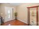 Inviting entryway with hardwood floors, decorative display case and plenty of natural light at 803 Coach House Ct, Rock Hill, SC 29730