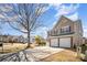 Two-story home featuring a two-car garage, large driveway, with well-maintained lawn and exterior at 803 Coach House Ct, Rock Hill, SC 29730