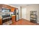 Kitchen area featuring stainless steel appliances and beautiful hardwood floors at 803 Coach House Ct, Rock Hill, SC 29730