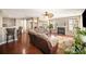 Open-concept living room with hardwood floors, a fireplace, and comfortable seating at 803 Coach House Ct, Rock Hill, SC 29730