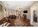 Cozy living room with wood floors, a ceiling fan, and an electric fireplace at 803 Coach House Ct, Rock Hill, SC 29730