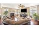 Bright living room featuring a fireplace, large windows, and hardwood floors at 803 Coach House Ct, Rock Hill, SC 29730