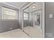 Bright bedroom with mirrored closet and view into an ensuite bathroom at 8101 Kerrybrook Cir, Charlotte, NC 28214
