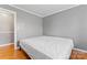 Neutral bedroom features hardwood floors, gray walls, and a spacious closet at 8101 Kerrybrook Cir, Charlotte, NC 28214