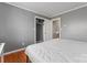 Neutral bedroom features hardwood floors, gray walls, and a closet at 8101 Kerrybrook Cir, Charlotte, NC 28214