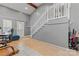 Hallway with stairs leading up, featuring tile floors and natural lighting at 8101 Kerrybrook Cir, Charlotte, NC 28214