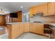 Kitchen with light wood cabinets, stainless steel appliances, and a breakfast bar at 8101 Kerrybrook Cir, Charlotte, NC 28214