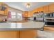 Spacious kitchen featuring stainless steel appliances, light colored cabinets and ample counter space at 8101 Kerrybrook Cir, Charlotte, NC 28214