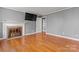 Cozy living room with hardwood floors, fireplace, and modern entertainment setup at 8101 Kerrybrook Cir, Charlotte, NC 28214