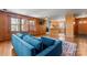Inviting living room with hardwood floors, wood paneling, and a view into the kitchen at 8101 Kerrybrook Cir, Charlotte, NC 28214