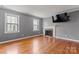 Inviting living room with fireplace and natural light from the windows at 8101 Kerrybrook Cir, Charlotte, NC 28214