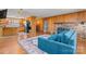 Open-concept living room with a brick fireplace, view into the kitchen, and hardwood floors at 8101 Kerrybrook Cir, Charlotte, NC 28214