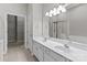 Primary bathroom with double sink vanity, shower, and walk-in closet at 8412 Brookings Dr, Charlotte, NC 28269
