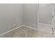Corner view of carpeted bedroom with doorway at 8412 Brookings Dr, Charlotte, NC 28269