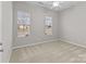 Bright bedroom with neutral walls and carpeted floors at 8412 Brookings Dr, Charlotte, NC 28269