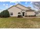 Well-maintained home exterior with a manicured lawn, complemented by tasteful landscaping at 8412 Brookings Dr, Charlotte, NC 28269