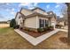 Charming home exterior with a stone accent wall, front yard, and sidewalk at 8412 Brookings Dr, Charlotte, NC 28269