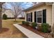 The home's exterior is enhanced by manicured shrubs and a well-maintained lawn at 8412 Brookings Dr, Charlotte, NC 28269