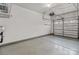 A clean, empty residential garage featuring a white door at 8412 Brookings Dr, Charlotte, NC 28269