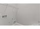 Laundry room including hook-ups and wire shelving at 8412 Brookings Dr, Charlotte, NC 28269