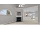Inviting living room with fireplace, arched window, and an open view to the kitchen with bar seating at 8412 Brookings Dr, Charlotte, NC 28269