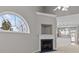 Living room with a fireplace, large window, and neutral wall color at 8412 Brookings Dr, Charlotte, NC 28269