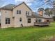 Spacious, green backyard view showcases the home's exterior and offers a tranquil outdoor space at 9904 Duane Ct, Huntersville, NC 28078