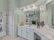 Bathroom with double sinks, white cabinetry, and ample counter space at 9904 Duane Ct, Huntersville, NC 28078