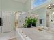 Bright bathroom featuring a large soaking tub and glass enclosed shower at 9904 Duane Ct, Huntersville, NC 28078