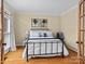 Comfortable bedroom with hardwood floors, large windows, and elegant trim at 9904 Duane Ct, Huntersville, NC 28078