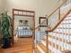 Inviting bedroom featuring hardwood floors and a decorative doorway at 9904 Duane Ct, Huntersville, NC 28078