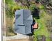 Overhead shot of a home with a dark roof, surrounding greenery, and an inviting outdoor patio space at 11000 King George Ln, Waxhaw, NC 28173