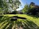 Huge backyard with a firepit and covered patio, perfect for outdoor living at 11000 King George Ln, Waxhaw, NC 28173