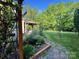 Charming backyard features a pergola, landscaping and well maintained lawn at 11000 King George Ln, Waxhaw, NC 28173