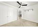 Bedroom featuring a ceiling fan, carpeted flooring, and a view of the hallway at 11000 King George Ln, Waxhaw, NC 28173