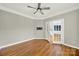 Cozy room featuring wood floors, fan, and ample natural light at 11000 King George Ln, Waxhaw, NC 28173