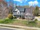 Beautiful two-story home with well-maintained landscaping and a welcoming entrance at 11000 King George Ln, Waxhaw, NC 28173