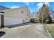 Two-car garage with driveway and fenced in backyard area at 11000 King George Ln, Waxhaw, NC 28173