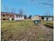 Spacious backyard featuring a shed and a set of chairs to enjoy the outdoors at 114 Eller Rd, Gastonia, NC 28056