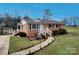 Beautiful brick house with a landscaped yard and a stone pathway at 114 Eller Rd, Gastonia, NC 28056