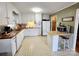 Functional kitchen with white cabinetry, wood countertops, and essential appliances at 114 Eller Rd, Gastonia, NC 28056