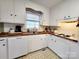 Efficient kitchen with white cabinetry, contrasting countertops, and ample storage at 114 Eller Rd, Gastonia, NC 28056
