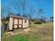 A shed with a natural wood finish at 114 Eller Rd, Gastonia, NC 28056
