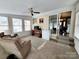 Cozy sun room with lots of windows for natural light, and sliding glass doors to the dining room at 114 Eller Rd, Gastonia, NC 28056