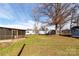 Spacious backyard featuring a screened-in porch and ample space for outdoor activities at 115 Setter Ct, Statesville, NC 28625
