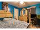 Bright bedroom features a ceiling fan, wood flooring, and neutral-colored walls with a large bed at 115 Setter Ct, Statesville, NC 28625