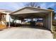 Spacious carport providing ample covered parking and storage space for vehicles and equipment at 115 Setter Ct, Statesville, NC 28625