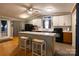 Modern kitchen featuring an island, marble countertops and a bar seating arrangement at 115 Setter Ct, Statesville, NC 28625