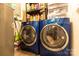 Organized laundry room featuring modern, front-load washer and dryer set at 115 Setter Ct, Statesville, NC 28625