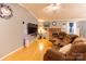 Cozy living room features a brick fireplace, ample seating, and a comfortable atmosphere at 115 Setter Ct, Statesville, NC 28625